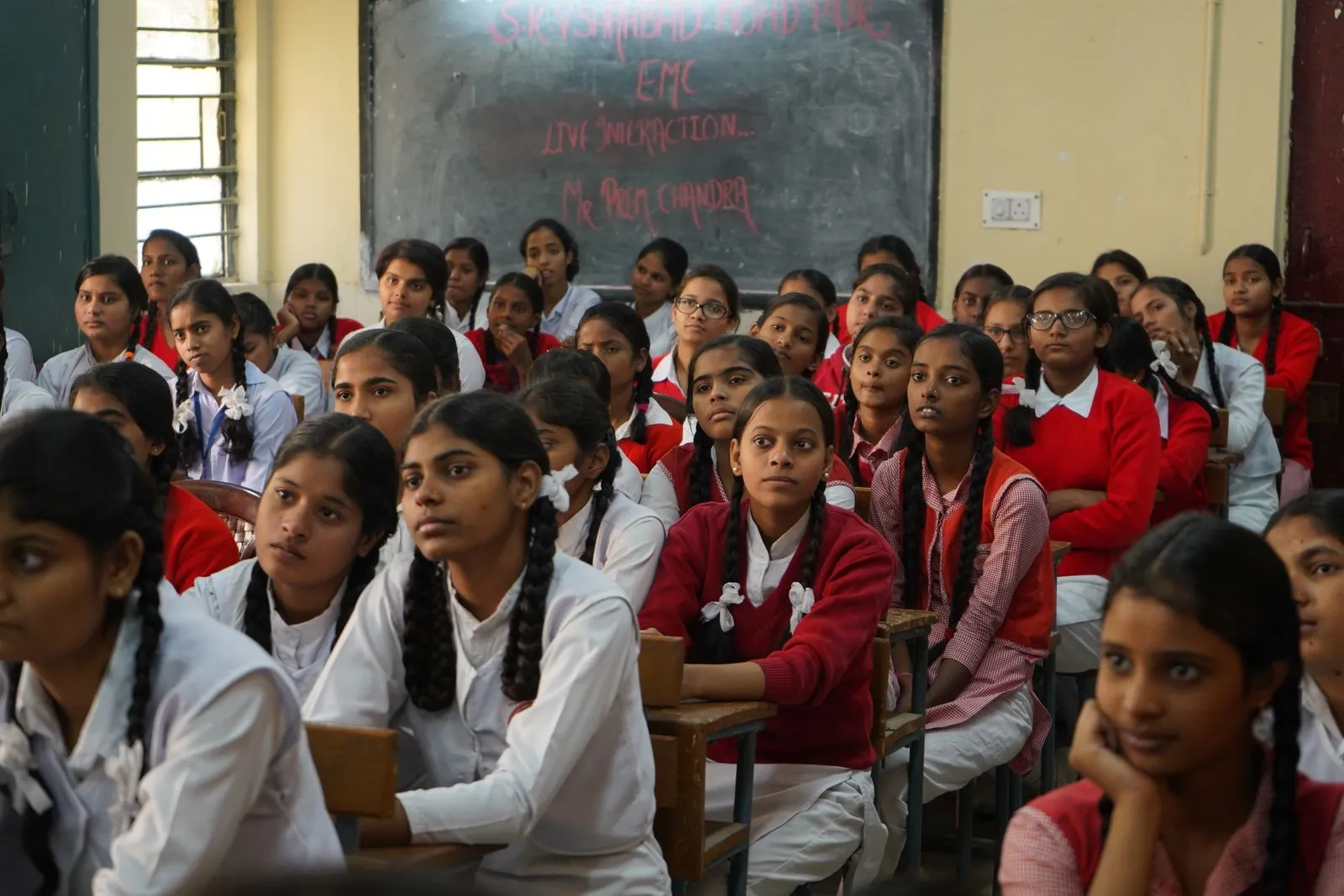 Schoolgirls listening in a classroom